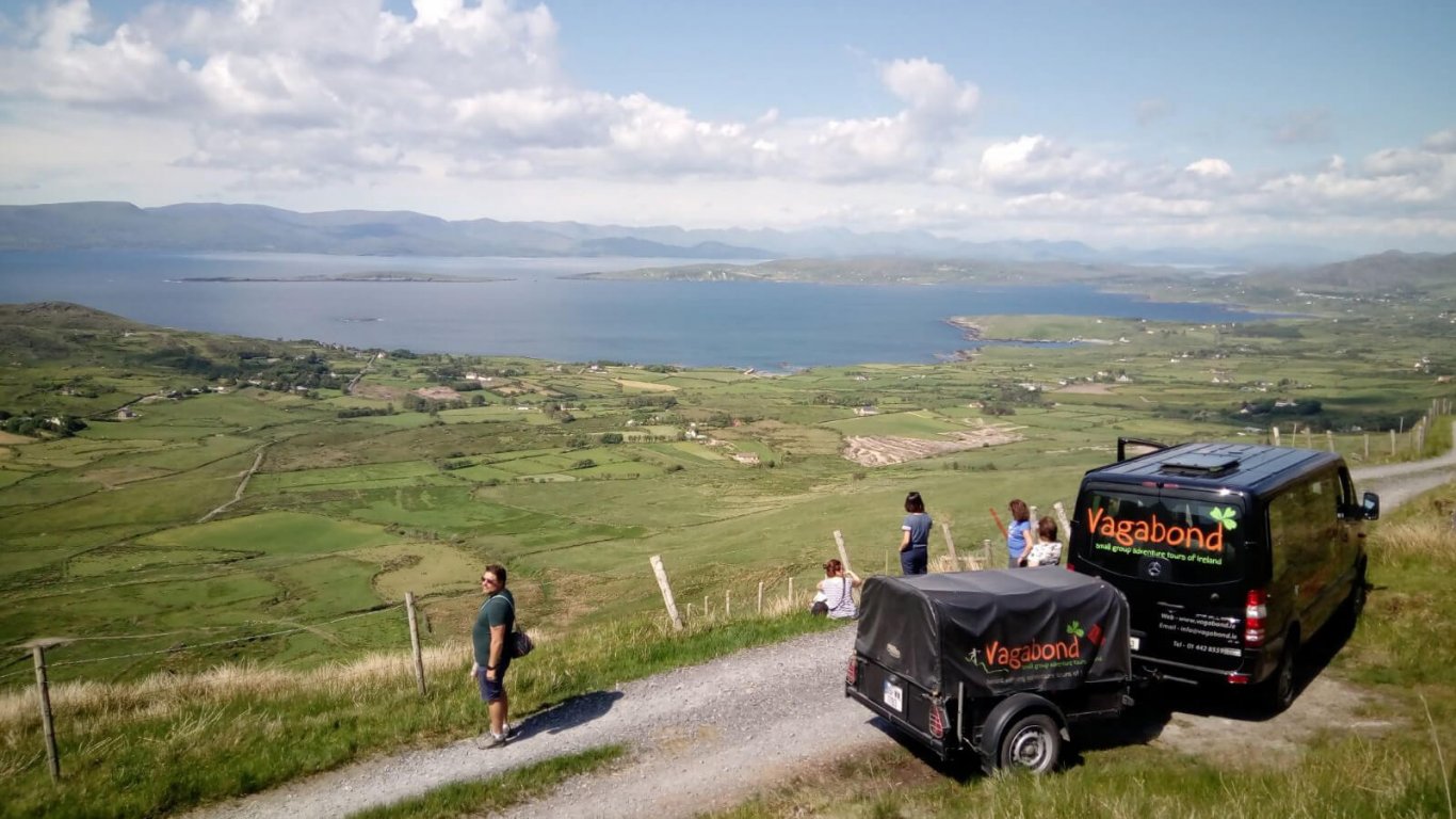 Vagabond tour vehicle and tour group stopped at a scenic spot on the Beara Peninsula, Ireland