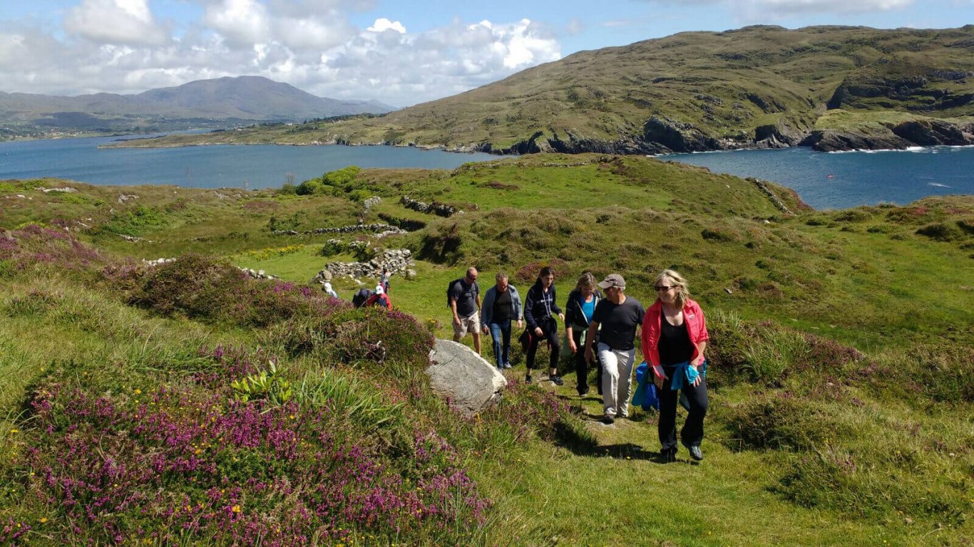 Vagabond tour guests hiking near Dunboy Castle on the Beara Peninsula, Ireland