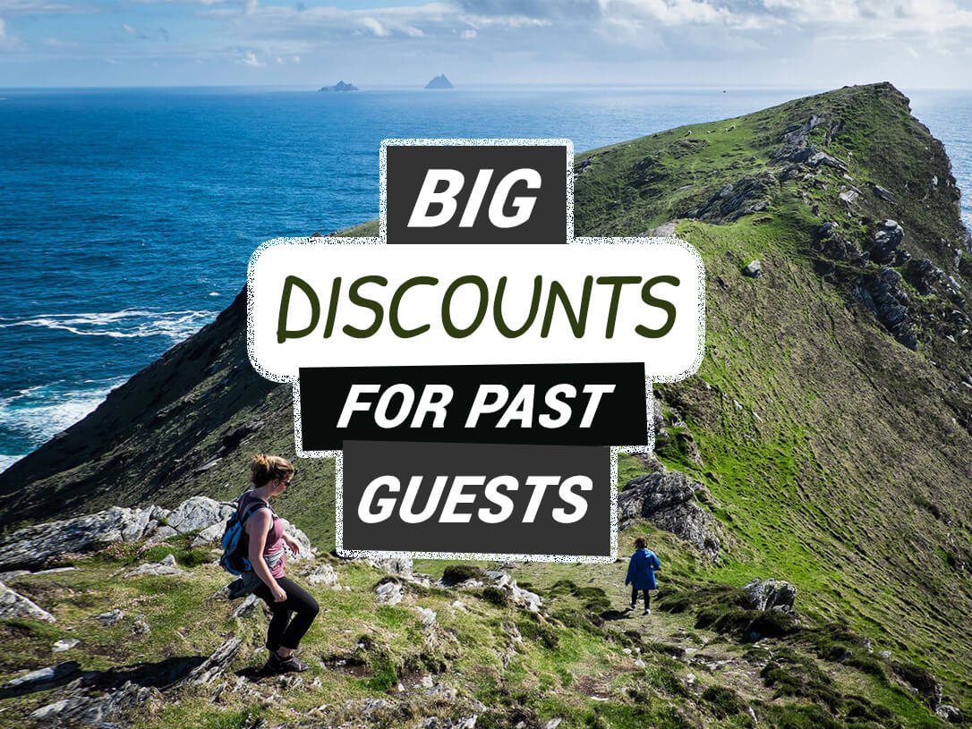 Big Discounts for Past Guests On Vagabond Small Group Tours of Ireland with hikers in scenic landscape
