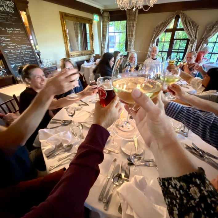 Guests raising their glasses in the restaurant in abbeyglen castle