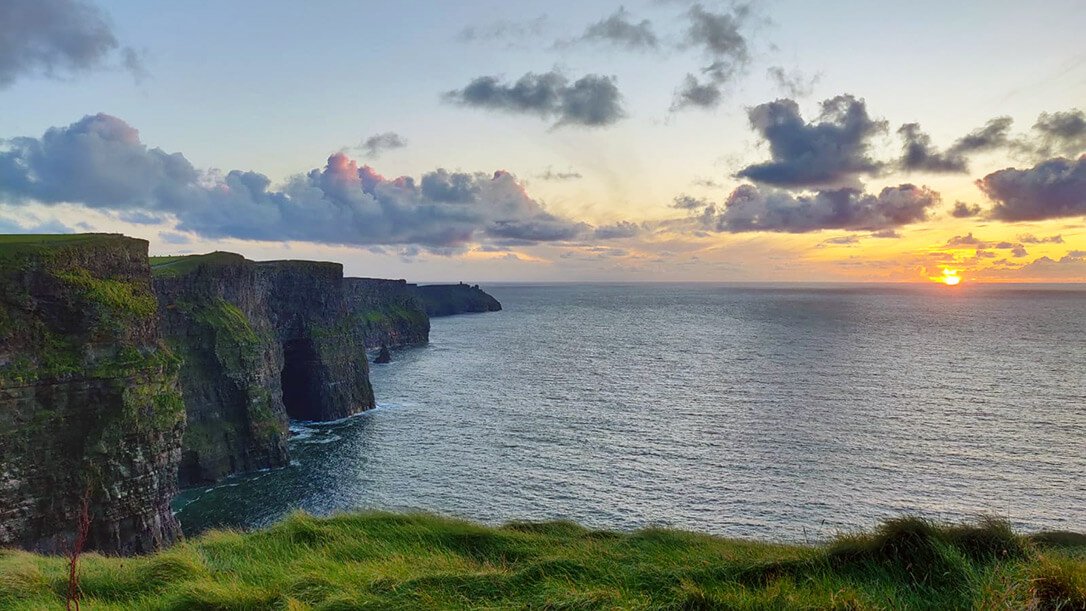 Our Ireland tours regularly visit the Cliffs of Moher for beautiful sunsets like this