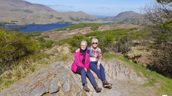 Two female tour guests in scenic location on Wild Atlantic Way tour of Ireland