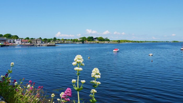 The picturesque town of Kinvara looking out to sea with boats in the harbour