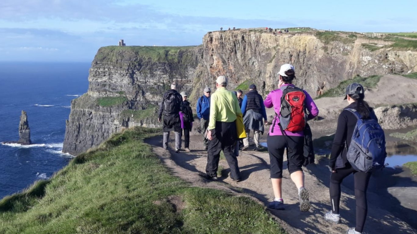 Vagabond Tour Group hiking the Cliffs of Moher in Ireland