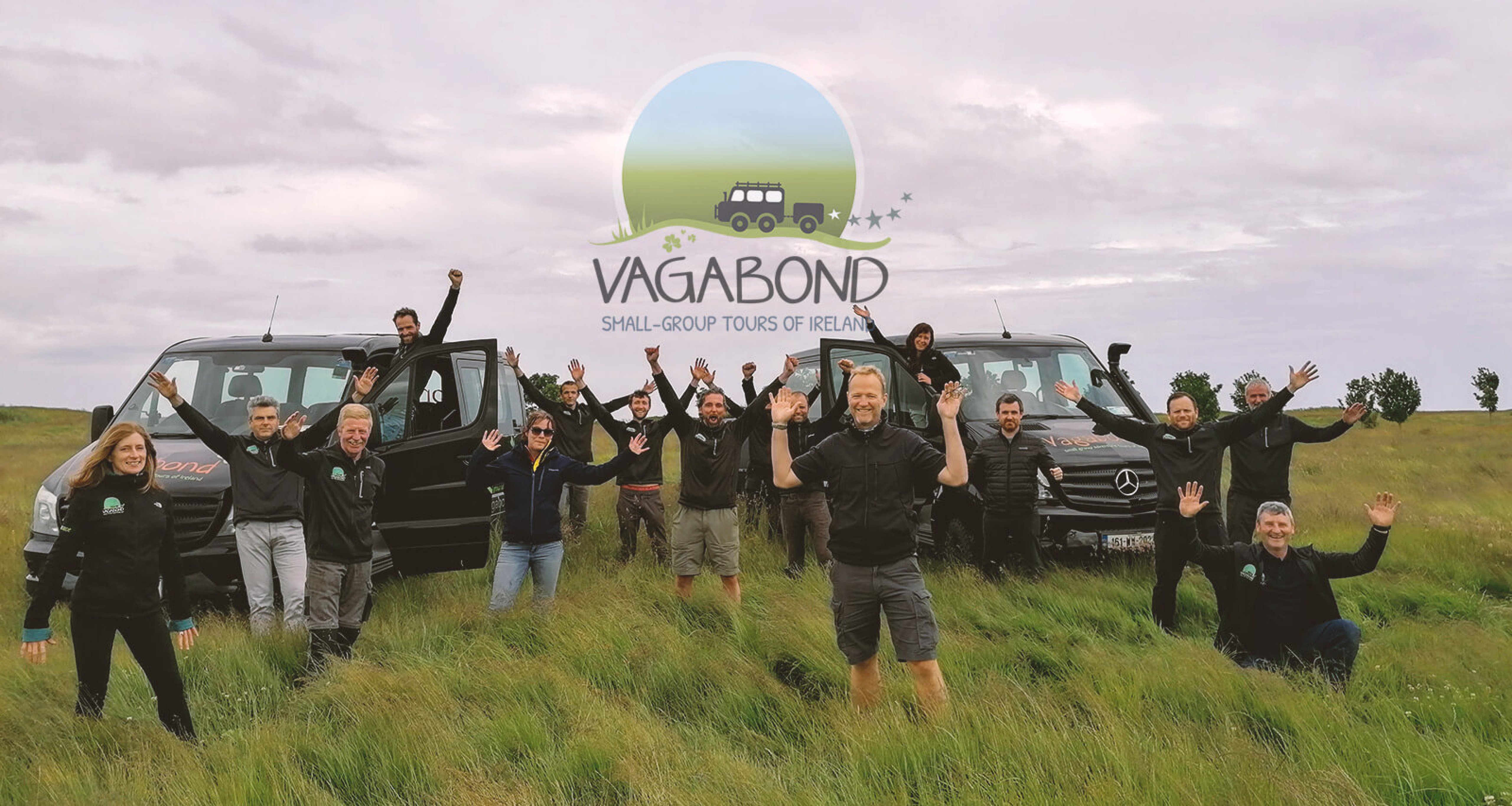 Vagabond tour guide team with company logo and vehicles