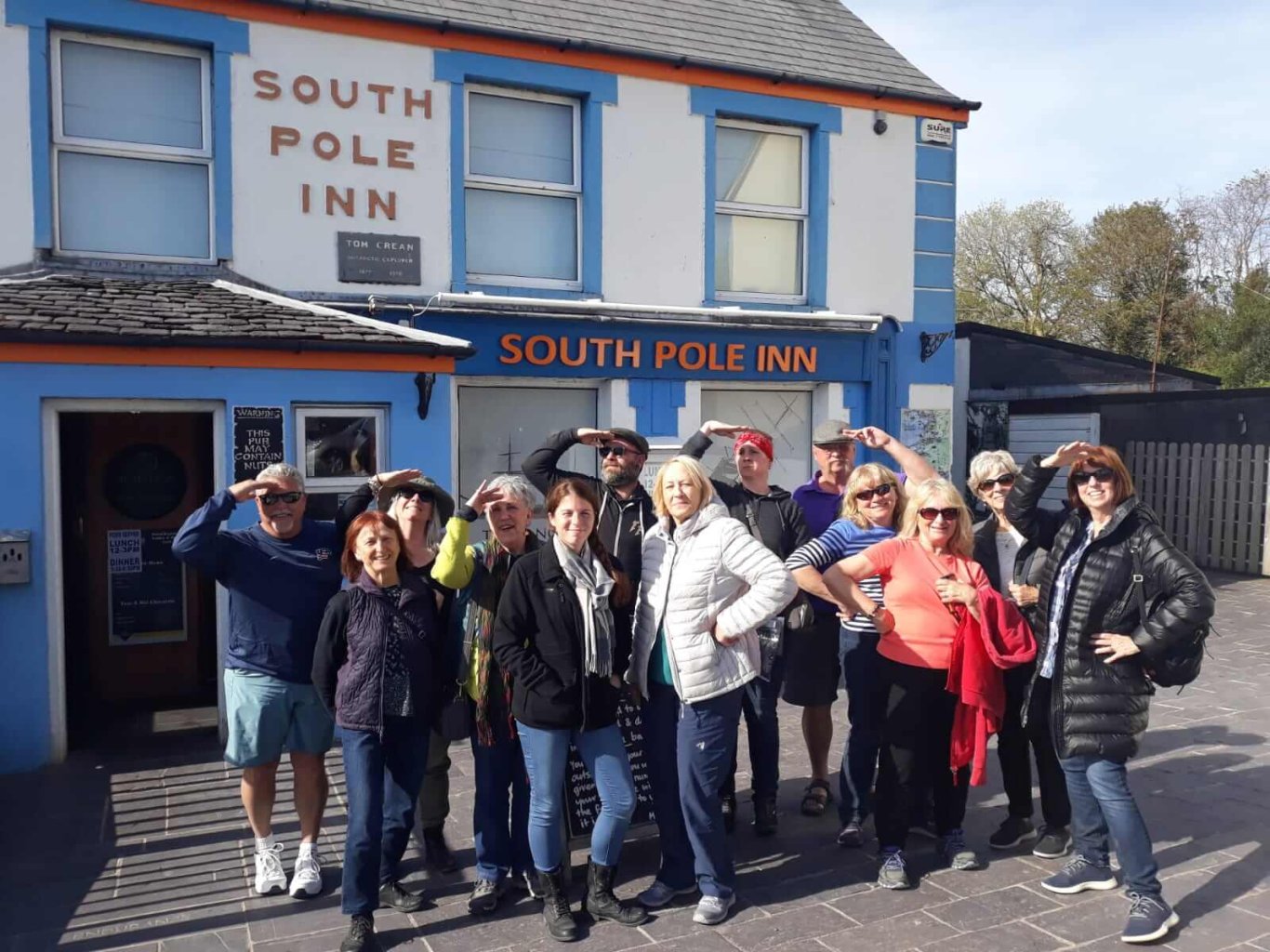 Tour group outside the South Pole Inn in Annascaul