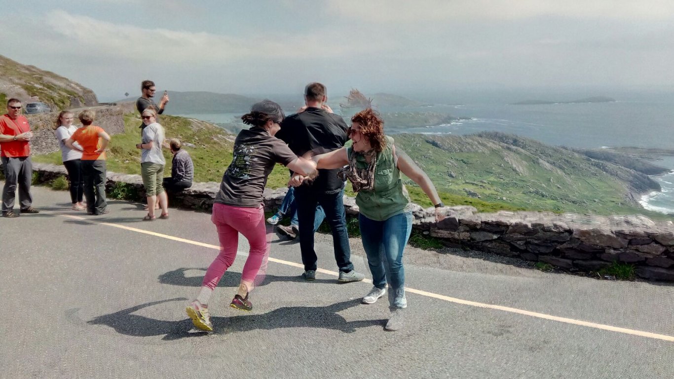Bébhinn teaching her tour guests to dance on the sunny Slea Head Drive in Ireland