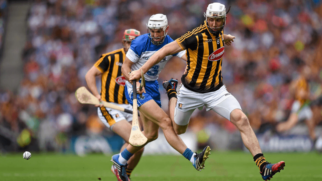 Two hurlers in the middle of croke park playing a game of hurling