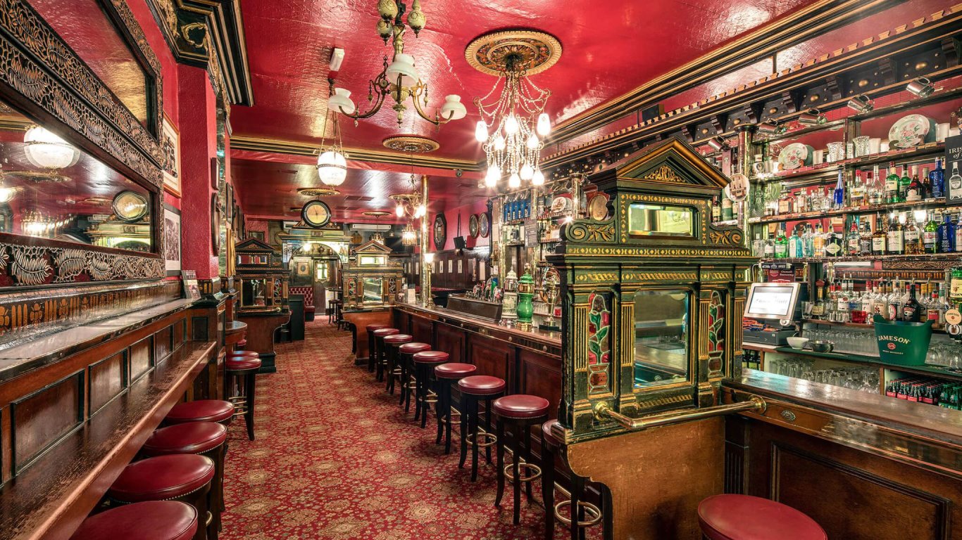 The colorful antique interior of the Long Hall Pub in Dublin, Ireland