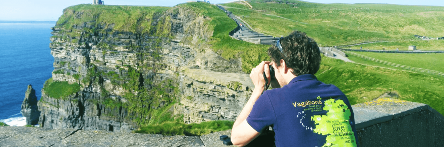 Vagaguide Henry taking a picture of the Cliffs of Moher 