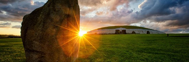 The sun setting over Newgrange 
