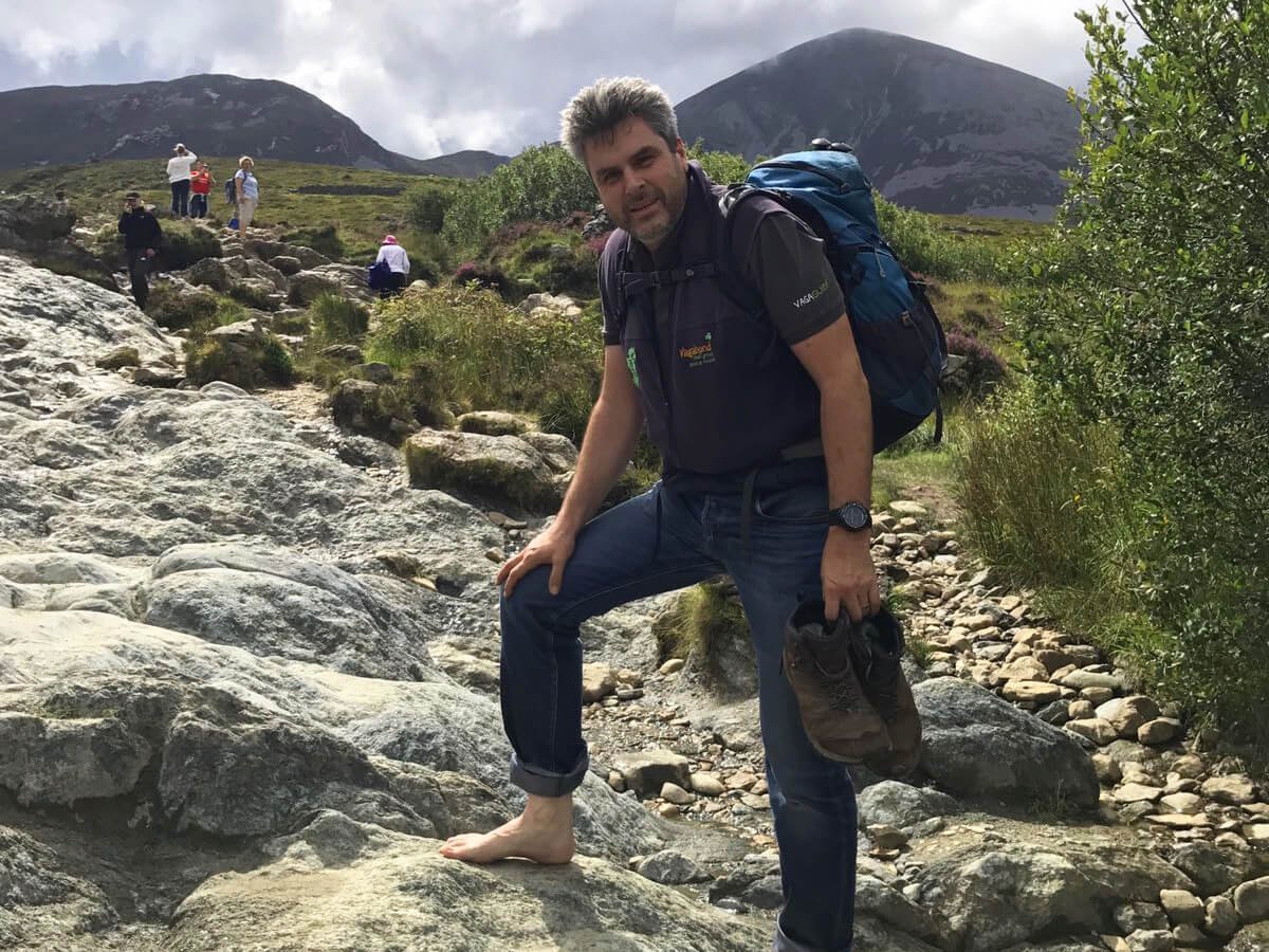 VagaGuide Tim hiking in Ireland at Croagh Patrick in Mayo without shoes on