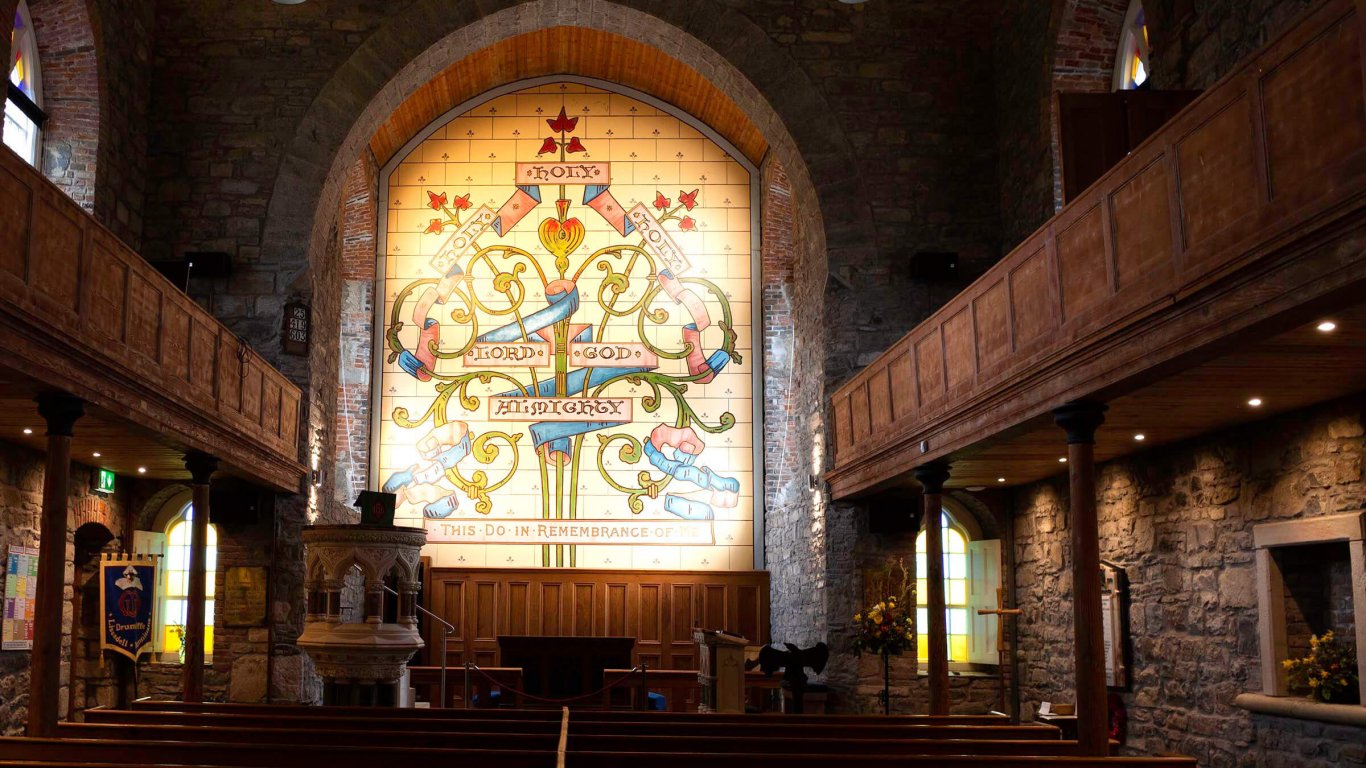 Interior of Drumcliff church in Sligo with stained glass window
