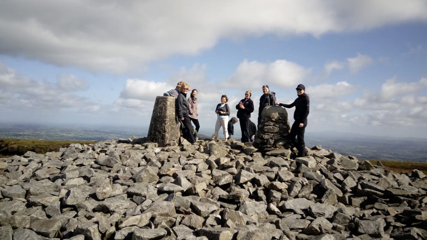 Hiking tour group on top of Slieve Gullion in Northern Ireland