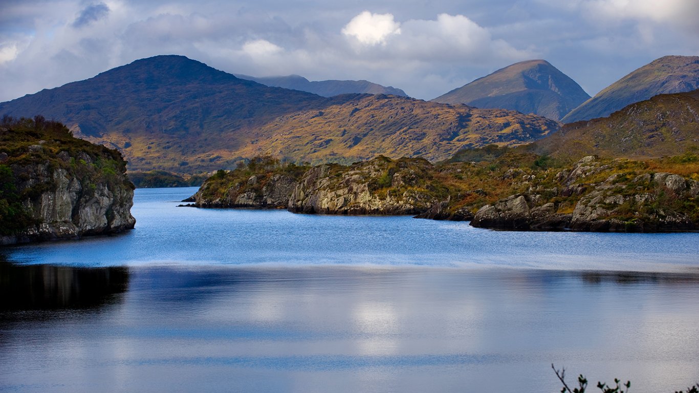 Scenic view of Killarney lake with mountains in the background