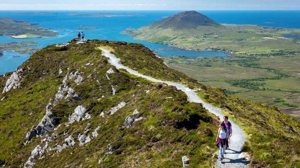 Hikers hiking to the summit of Diamond Hill overlooking Connemara