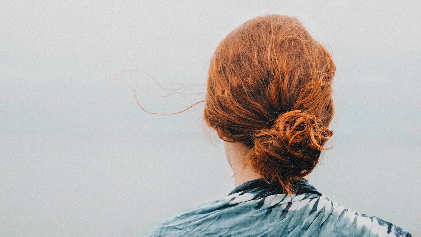 Red haired person from the back