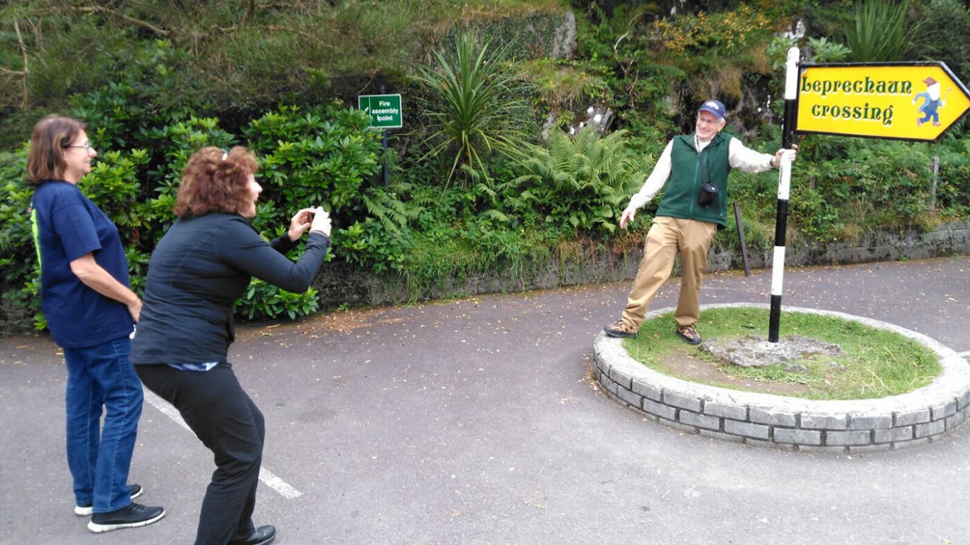 guest posing at a leprechaun crossing