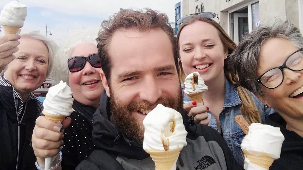 Tour group eating 99 ice creams during summer in Ireland