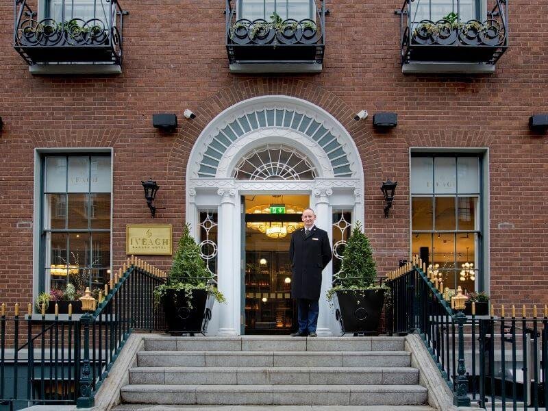 Doorman stands outside Iveagh Garden Hotel in Dublin