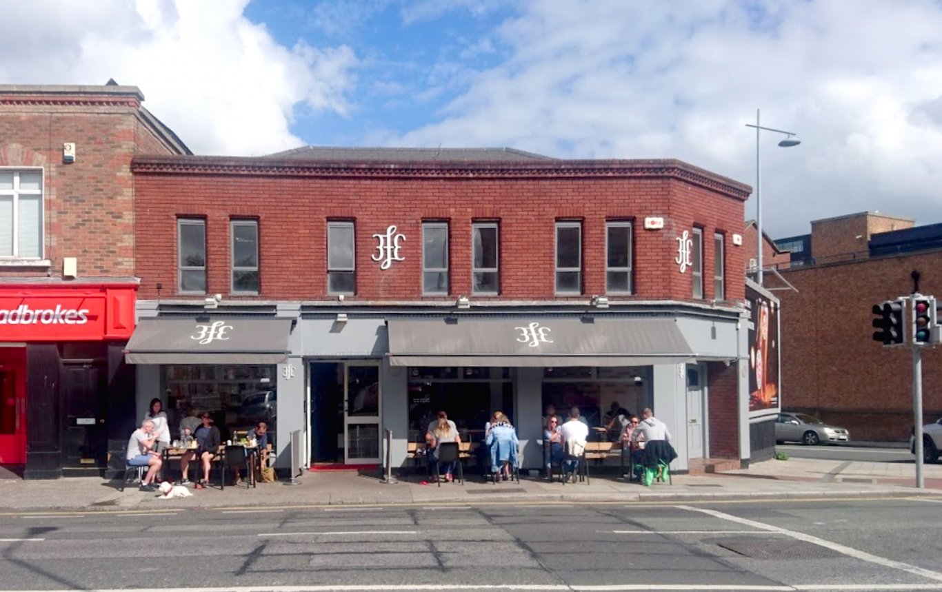 Patrons sit outside 3fe cafe on Grand Street Lower in Dublin
