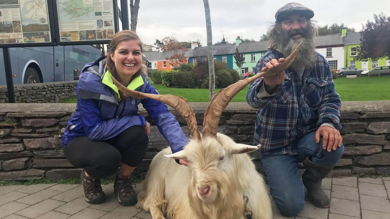 A woman and a farmer along with a goat at the Puck fair 