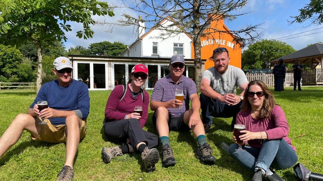 A group outside the south pole inn