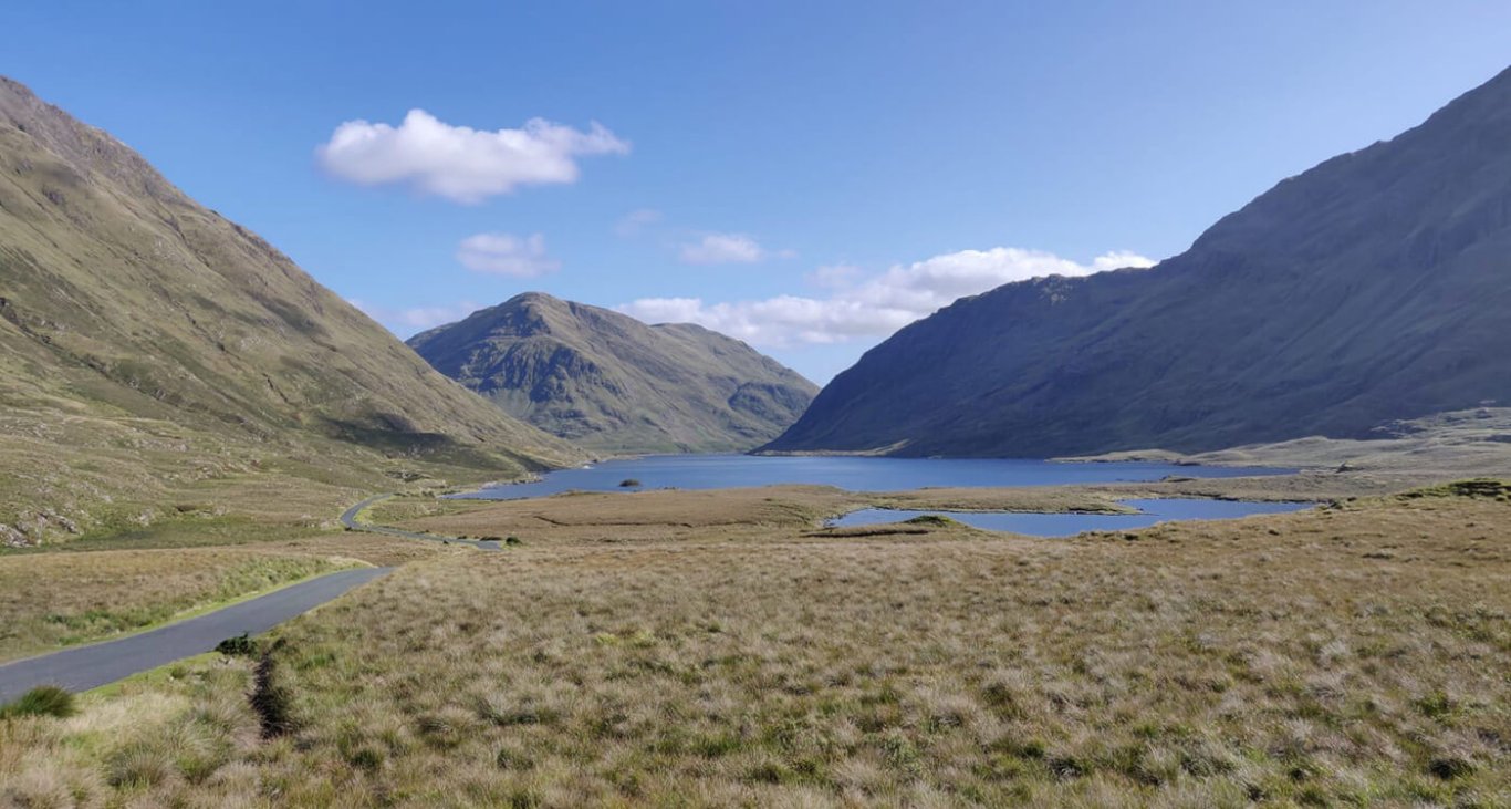 The doolough valley and lake under blue skies