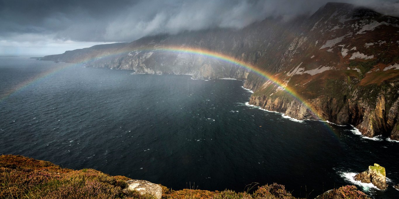 Slieve League cliffs with rainbow in Ireland