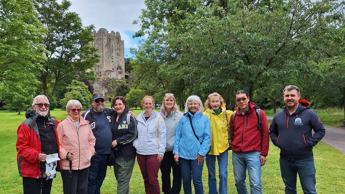 Driftwood tour group posing near Blarney Castle in Ireland