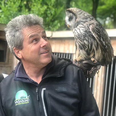 Tour Guide Tim with an owl leading a Vagabond Small-Group Tour of Ireland