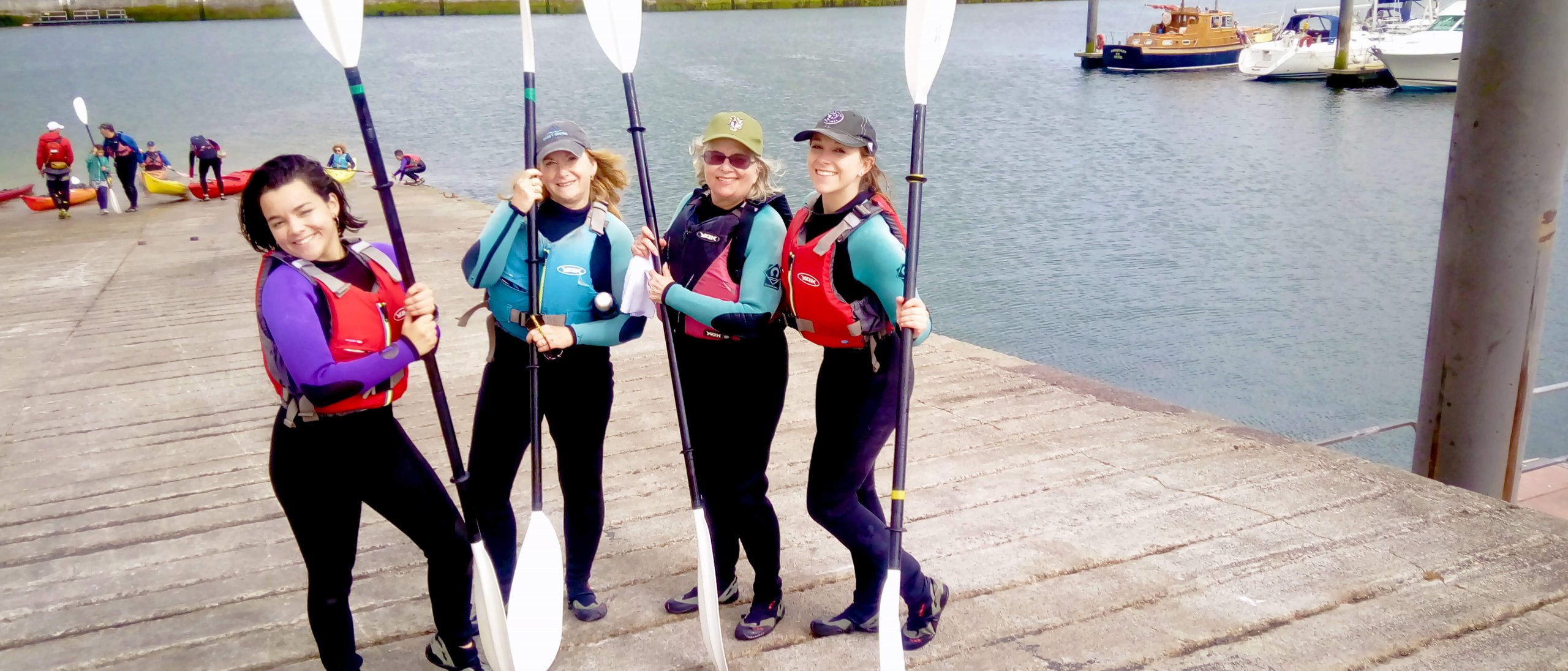 Four guests getting ready to go kayaking in Dingle