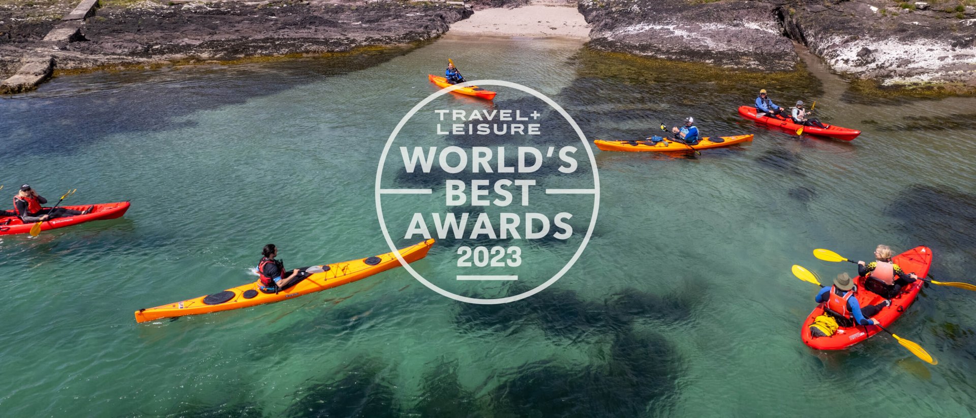 Aerial shot of kayaking group in Ireland with Travel + Leisure World's Best Awards 2023 Logo super-imposed on top