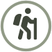 A black and white icon of a man hiking with a bag on his back and stick in his hand 