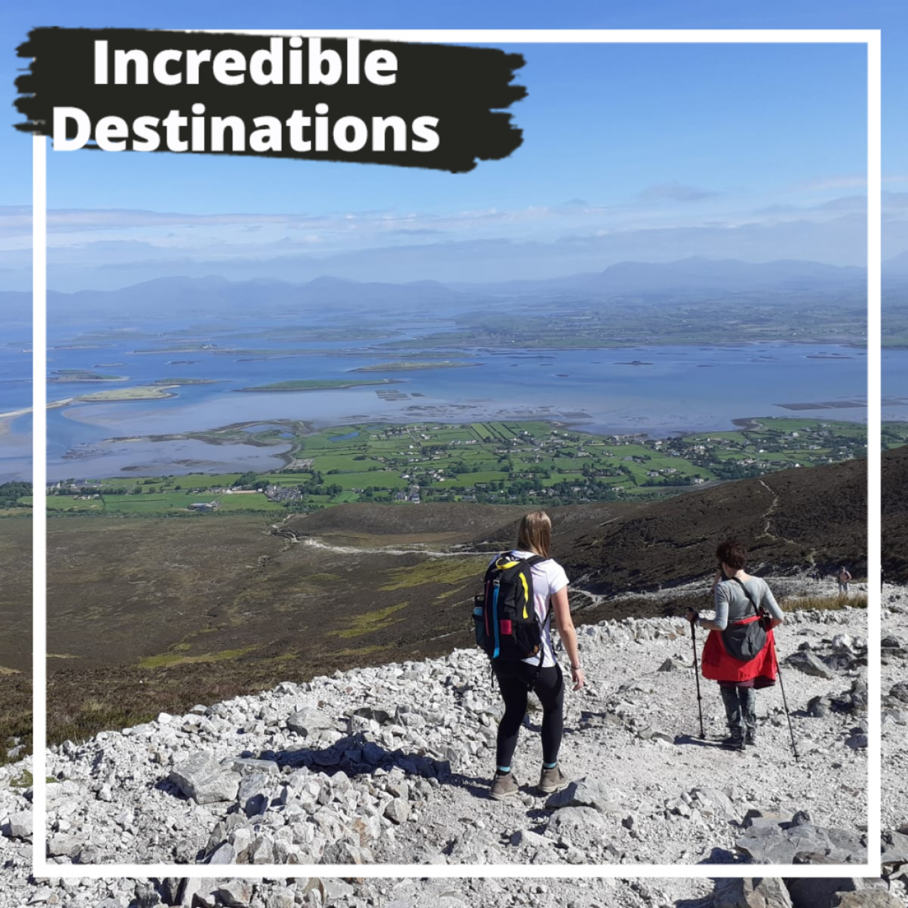 Vagabond guests on top of croagh patrick looking down on clew bay