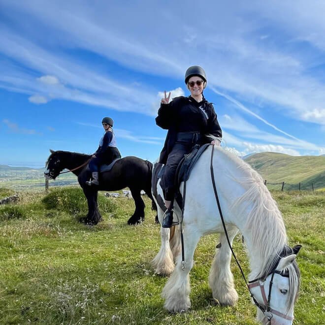 Two tour guests on horseback in Ireland