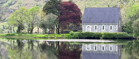A scenic chapel located on a lake in Gougane Barra, Ireland