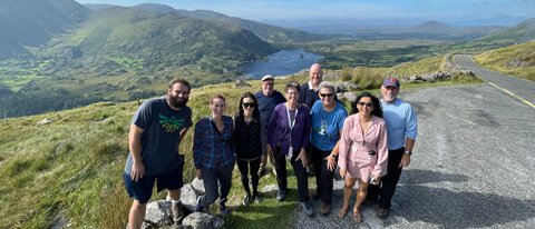 Tour group in Ireland in scenic landscape