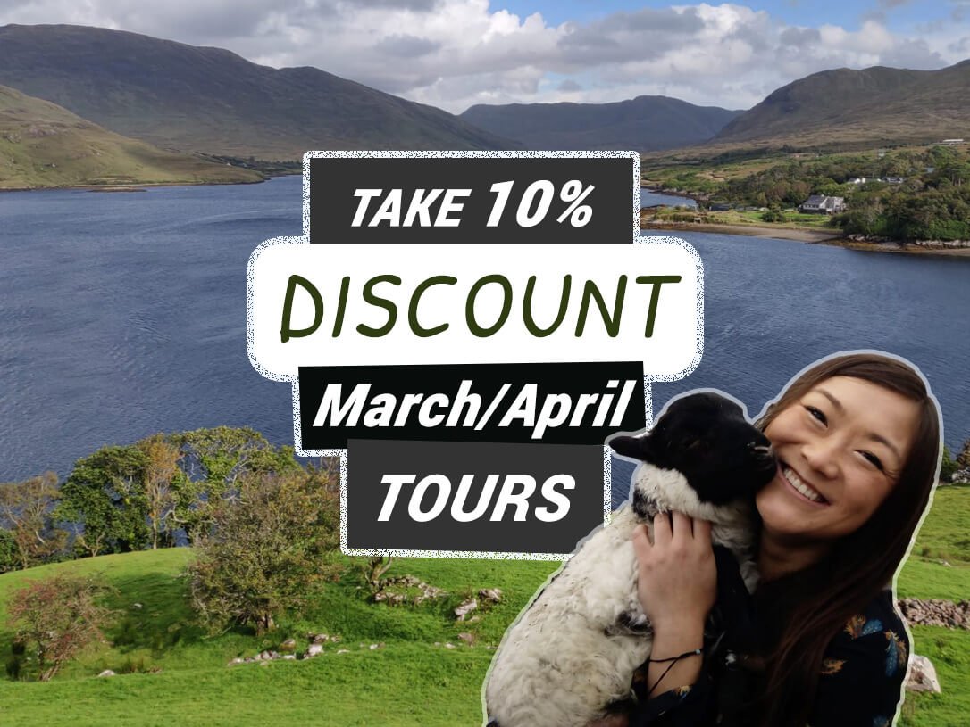 Take 10 percent off springtime March and April Ireland Tours with a happy lady cuddling a lamb in scenic landscape