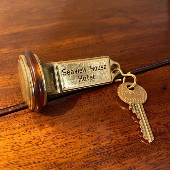 Close up of Seaview House Hotel key with decorative key ring