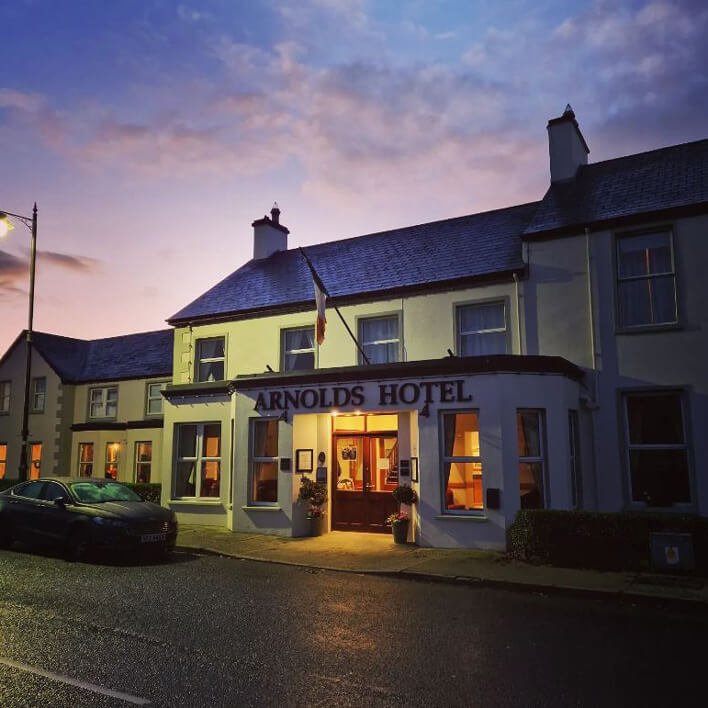 Exterior facade of Arnolds Hotel at night in Dunfanaghy, Ireland