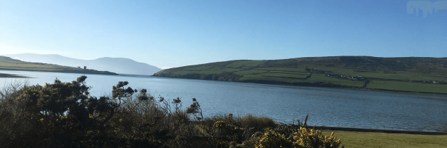 A panoramic view of Dingle Bay on with the sun shining and blue skies 