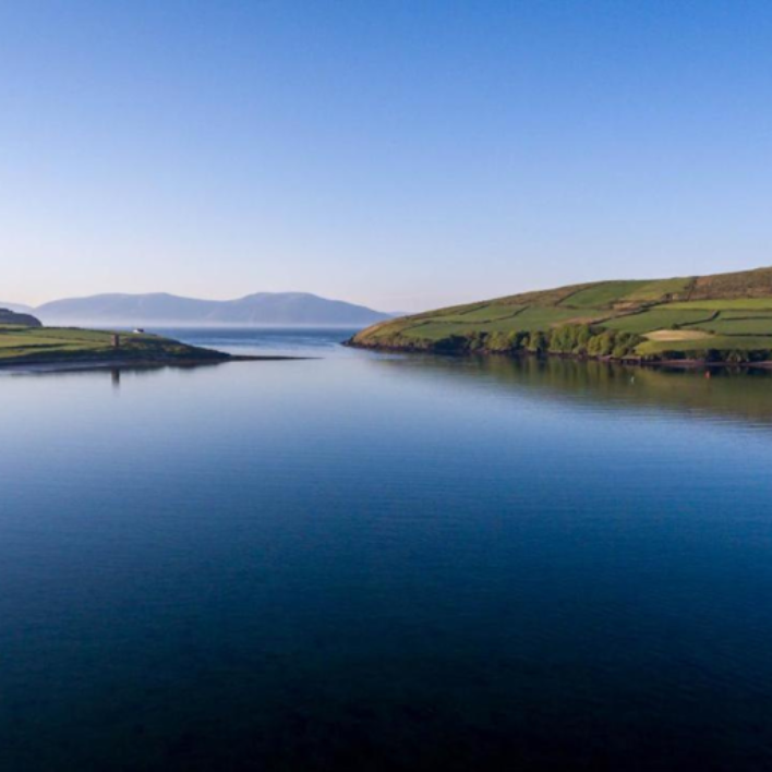 Dingle Bay on a beautiful day with blue skies and a glow off the bay