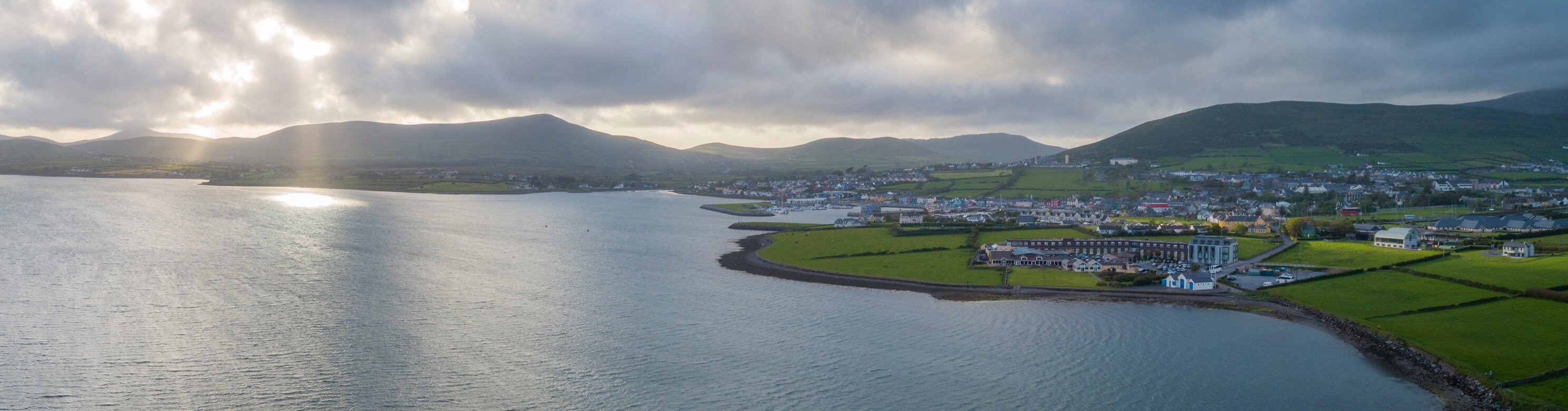 Scenic drone shot of Dingle Bay and Dingle Skellig Hotel in Ireland