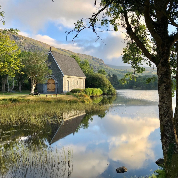 A view of the gougane barra church from across the lake