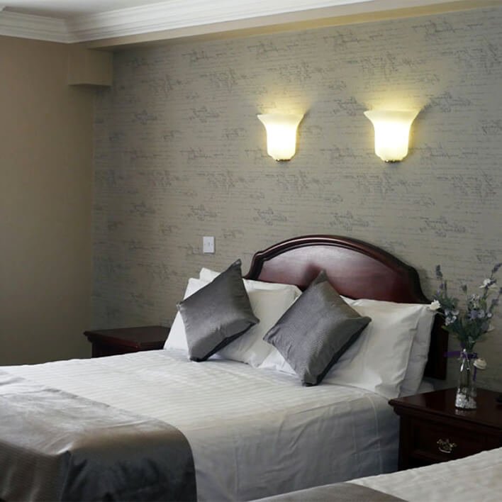 Interior design of a main bedroom in the Nesbitt Arms 