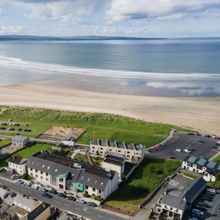 An aerial view of enniscrone beach from behind houses
