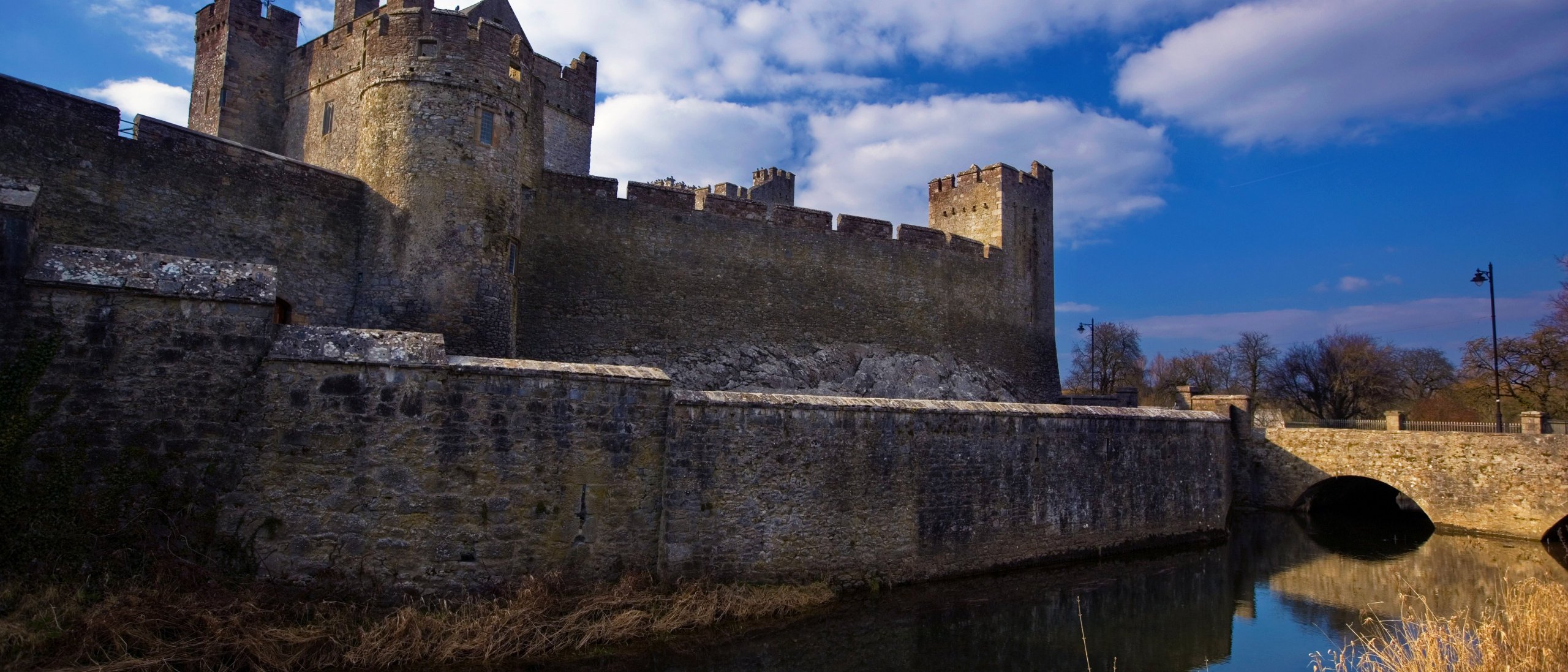 The exterior of Cahir Castle and the river Suir