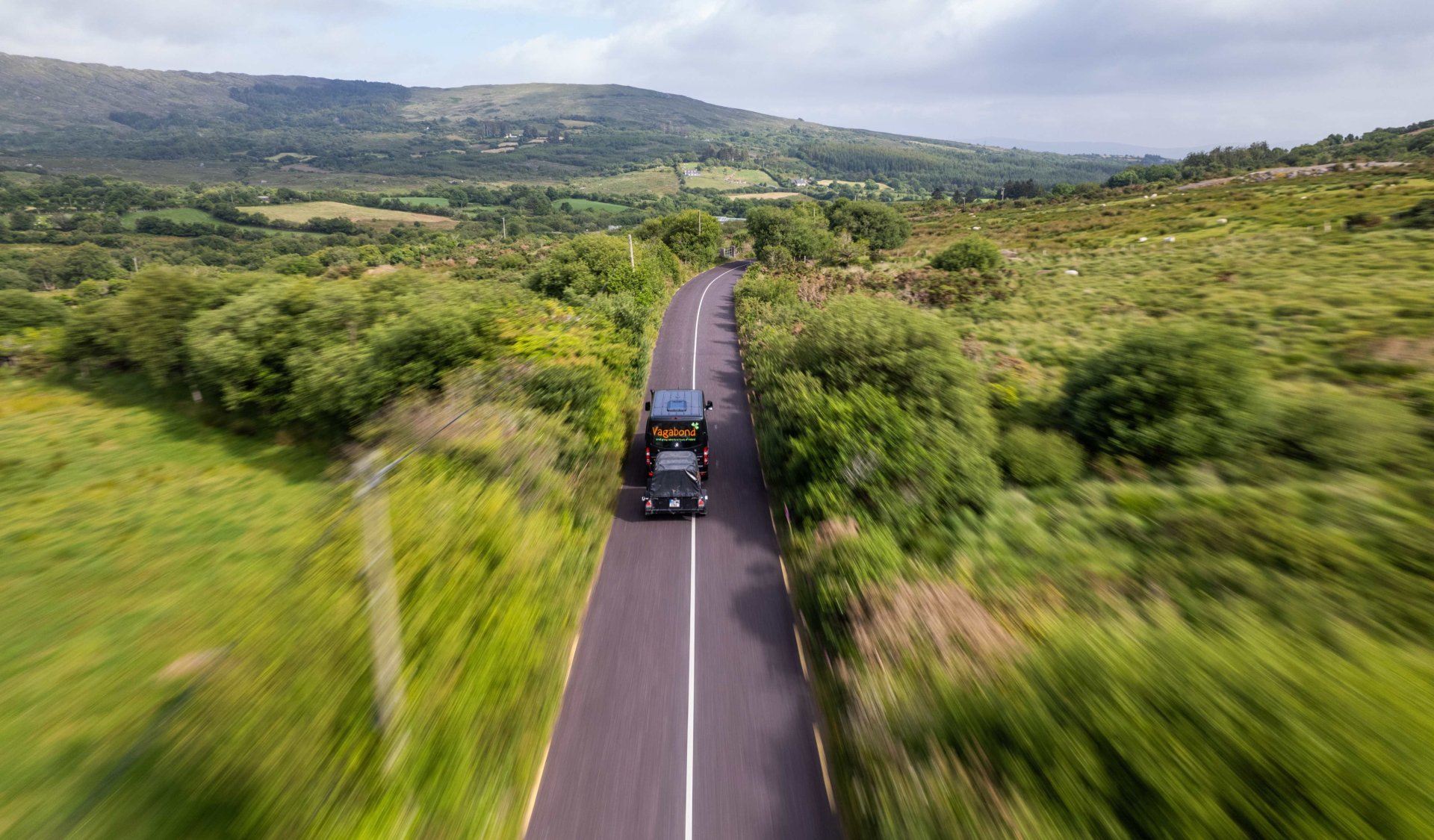 The vagabond vehicle driving on a country road