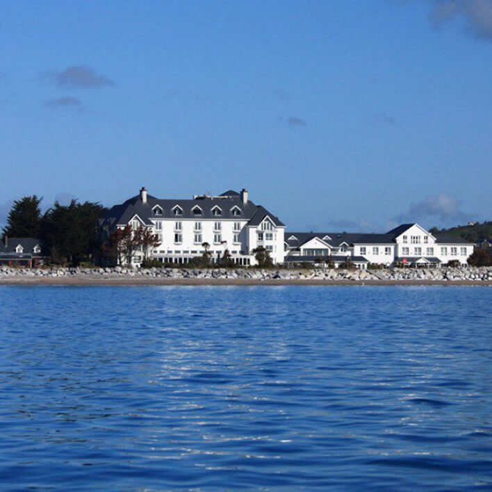 The exterior of the Garryvoe hotel and a view of Ballycotton Bay